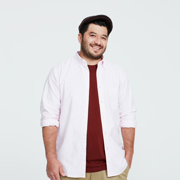 Smiling man wearing hat and white shirt
